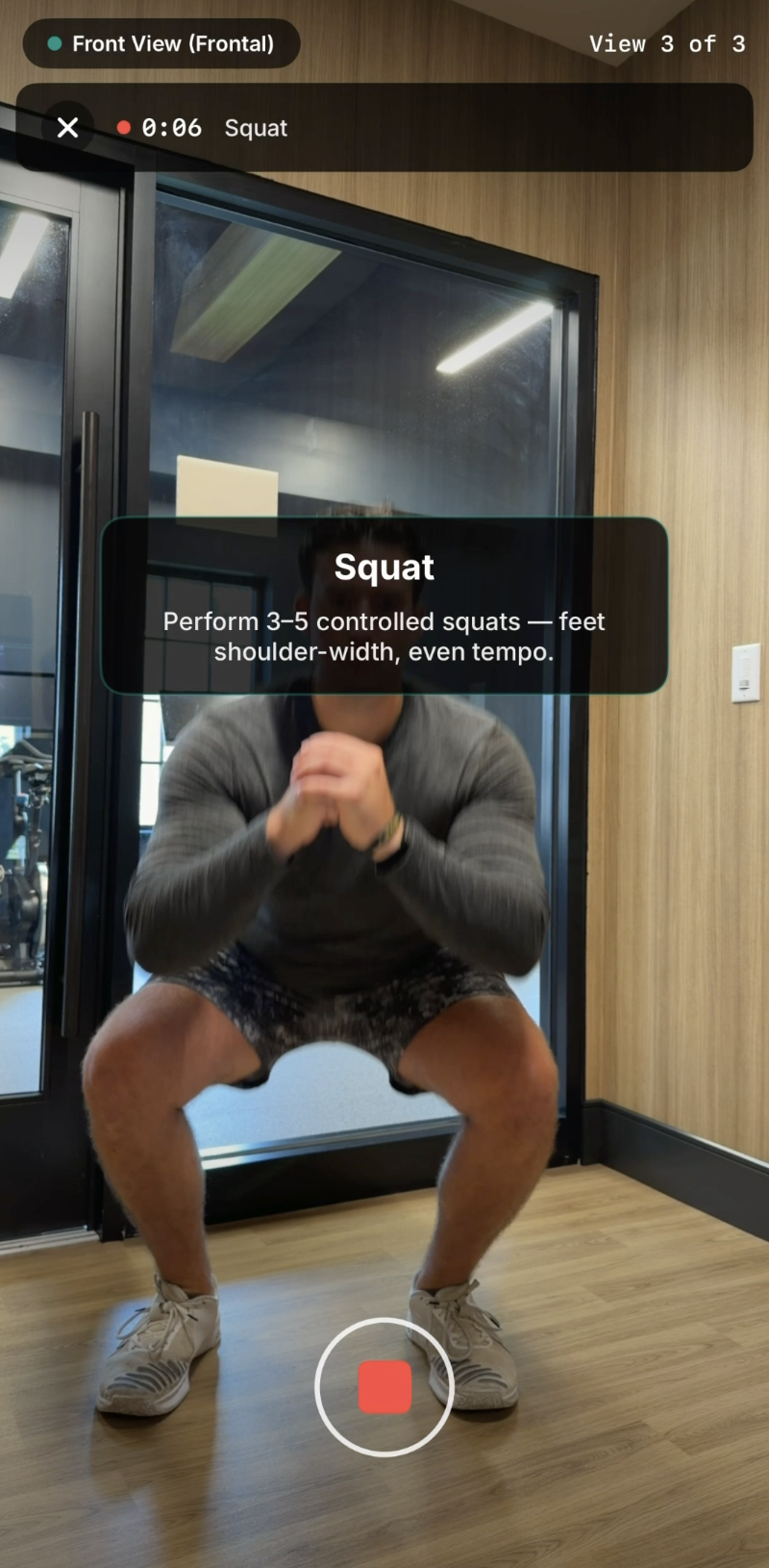 Frontal view capture, view 3 of 3, with squat instructions on screen